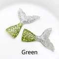 Close-up of resin mermaid tail accessories in green with detailed scale texture - Green
