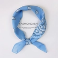 Light blue square silk scarf featuring white paisley pattern in a stylish knot - Paisley Light Blue