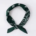 Dark green paisley silk scarf with white floral print tied in a loop knot - Paisley Army Green