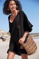 Close-up of black cotton beach cover-up with ruffled V-neck and delicate crepe texture - S / Tops / Black
