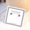 Sparkling Evil Eye stud earrings with blue crystals and silver-tone finish on luxury card - White Gold (ED558)