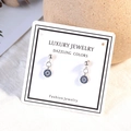 Silver evil eye stud earrings with blue and white crystals in a round mandala design - White Gold (ED557)