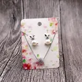 Detail of silver bunny jewelry set with pearls and crystals on floral display card - Pink Cherry Blossom (Earring Card) / 5x7cm