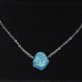 Delicate silver chain necklace featuring a blue synthetic opal Hamsa hand pendant - Light Blue Opal Style(5)