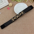 Slim black elastic waist belt for women featuring a vintage gold hollow buckle design - Black / 65cm