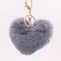 Detail view of a fluffy grey faux fur heart keychain with polished gold metal lobster clasp - Dark Gray / Silver Circular Single-ring Buckle