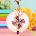 Plush ball keychain with purple rhinestone windmill charm and gold-plated hardware - Purple Windmill + White Pom Pom