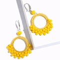 Bohemian style yellow beaded hoop earrings with handmade woven texture and silver hooks - Yellow