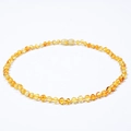 Detailed view of polished natural Baltic amber beads with a secure screw clasp - Golden Amber Necklace