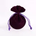 Dark purple velvet drawstring jewelry pouch with circular base and soft texture finish - Purple