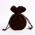 Dark brown velvet drawstring jewelry pouch with round base and petal-shaped opening - Brown