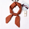 Elegant caramel satin twilly scarf for women shown with stylish fashion accessories - 70x70cm / Caramel