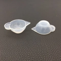 Detailed view of translucent silicone mixing cups with pouring spouts for DIY resin art - Silicone Color Mixing Cup