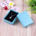 Sky blue jewelry box with textured surface and silver star necklace on black sponge - 7x9x3cm / Sky Blue