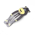 Detail of metal snap clip featuring a cartoon monkey design with yellow face and purple mouth - Bear