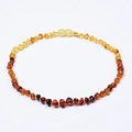 Macro detail of natural Baltic amber necklace with irregular beads and screw clasp closure - Rainbow Necklace