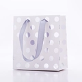 Detail showing white paper gift bag with silver foil polka dots and lavender ribbon handles - Silver Polka Dots / 14*7*15cm