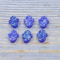 Macro view of blue resin Hamsa Opal palms with colorful holographic glitter flakes - Hand Shape No Hole / Blue