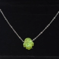 Macro shot of green synthetic opal Hamsa hand pendant necklace on black velvet display - Yellow-Green Glitter Style(8)