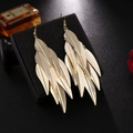 Detail of layered gold feather earrings hanging on a black velvet jewelry box - S4301-1 Layered Feather