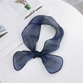 Navy blue polka dot organza scarf tied in a bow on a minimalist desk setting - Polka Dot / Navy Blue