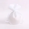 White semi-transparent drawstring jewelry pouch with elegant scalloped edges and texture - White