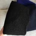 Close-up of pleated cotton linen scarves in black, dark blue and royal blue colors - Navy Blue