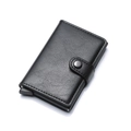 Detail of black lychee grain leather card holder with automatic pop-up button mechanism - Black