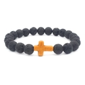 Detail view of black volcanic lava stone beads with a rustic yellow cross pendant charm - Orange Cross