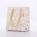 Elegante sacchetto regalo in carta bianca a pois dorati con manici in nastro di seta - Pois Dorati