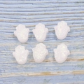 White synthetic opal Hamsa hand beads with iridescent luster on striped wood background - Hand Shape No Hole / White