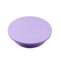 Detailed view of a purple plastic cake turntable with concentric measuring scales - 28cm (Large) / Purple