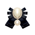 Detail of a vintage black ribbon bow brooch featuring faux pearls and sparkling rhinestones - Black With Pin