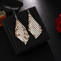 Detail of golden mesh tassel earrings with a metallic finish on a black velvet box - H4531-2 Rhombus Sequin Grid