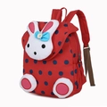 Red children's backpack with blue polka dots and a 3D plush rabbit decorative element - Red