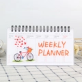 Wekelijkse planner met spiraalbinding en kleurrijke hartjes illustraties - Fiets