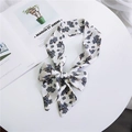 Floral silk scarf hair band in white and gray-blue, tied in a stylish bow on a table - White Grey Blue Floral