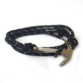 Black speckled rope wrap bracelet with silver Viking anchor clasp on white background - Black and White Spots