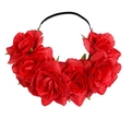Detailed view of large fabric red roses on a flexible black elastic headband for parties - Red