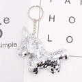 Detail of a silver sequin unicorn keychain with reflective surface and metal ring - Silver