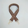 Detail of adjustable woven bag strap with geometric chain pattern and gold metal hardware - Brown Circles