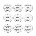 Detailed view of nine round stainless steel charms with sisters by heart engraving - Sisters by Heart / 20mm