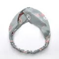 Light blue floral twist headband with pink daisy pattern and elastic back band - Green Floral