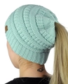 Detail of mint green cable knit open top hat showing ponytail hole and leather patch - M (56-58cm) / Sky Blue