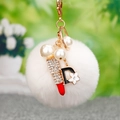 White fluffy pompom keychain with rhinestones lipstick and pearl charms in gold finish - D Letter Lipstick White Pom Pom