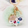 Light green faux fur pom-pom keychain with crystal encrusted sheep charm in gold plating - White Lamb + Light Green Pom Pom