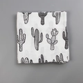 Folded white baby muslin swaddle blanket with black cactus print in soft cotton fabric - Black and White Cactus