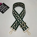 Detail of adjustable woven bag strap in cream and dark green with gold metal clasps - Green Circles
