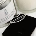 Detailed view of a silver hollow lip-shaped hair clip on black velvet background - Lips Silver