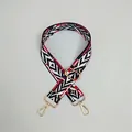 Close-up of ethnic geometric woven bag strap with golden metal hooks and adjustable buckle - #21 BW Rhombus